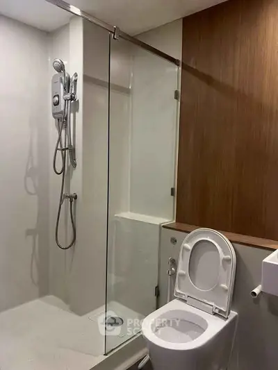 Modern bathroom with glass shower and sleek toilet design