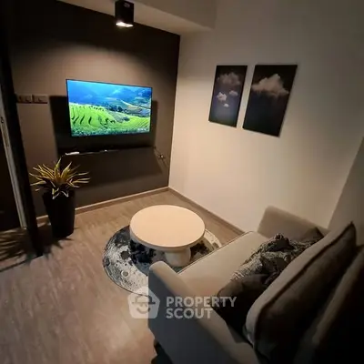 Cozy living room with modern decor and wall-mounted TV