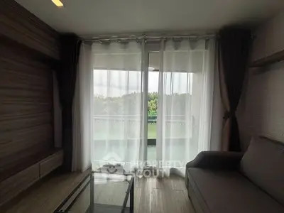 Modern living room with large window and balcony view