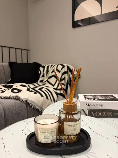 Stylish living room with cozy sofa, chic decor, and elegant coffee table setup.