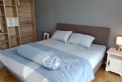 Spacious bedroom with modern decor and ample natural light