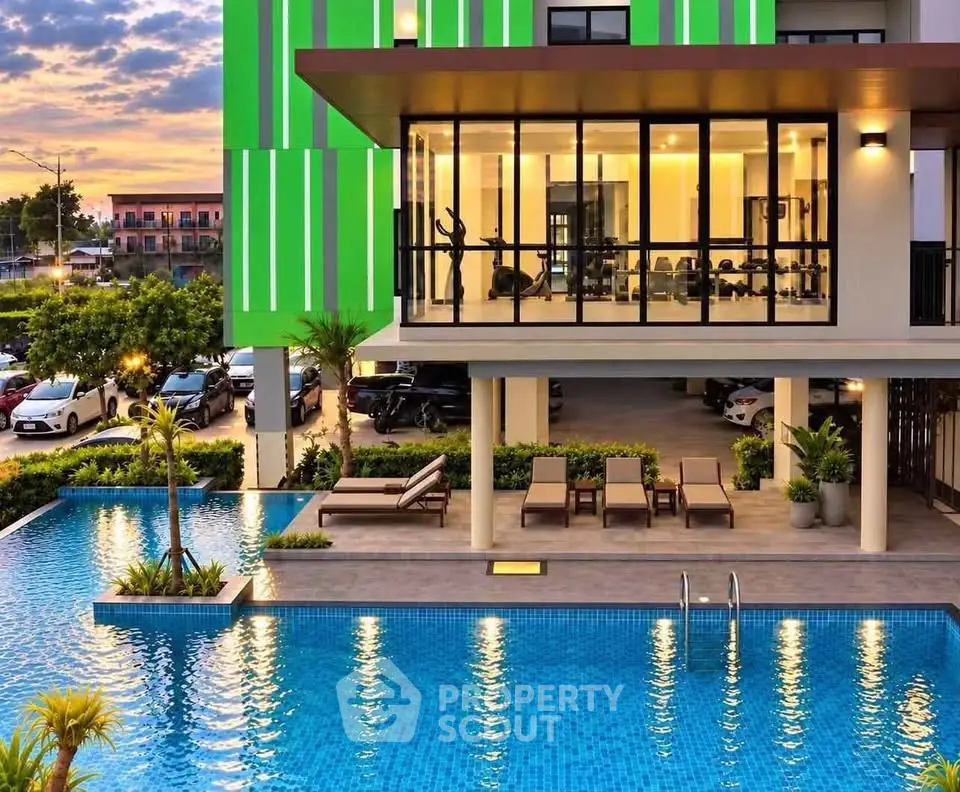 Modern building with gym and pool, perfect for luxury living.