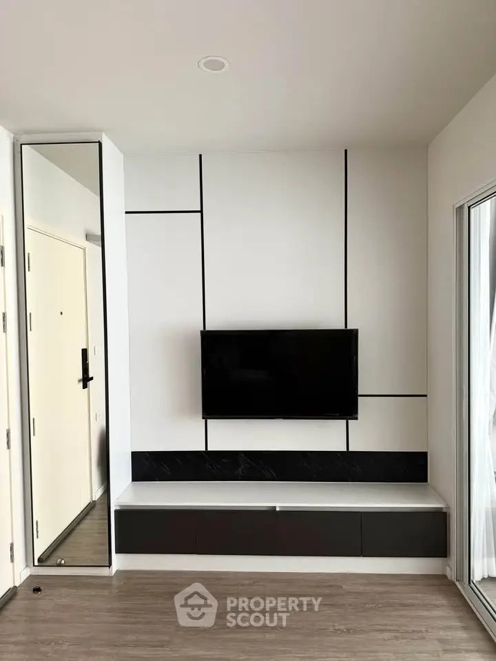 Modern living room with sleek TV setup and minimalist design