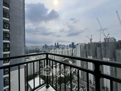 Stunning urban balcony view with city skyline and construction cranes