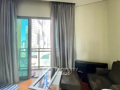 Modern living room with balcony view in high-rise apartment