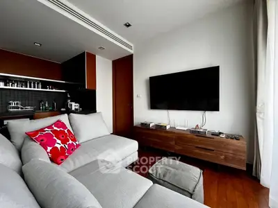 Modern living room with sleek furniture and wall-mounted TV