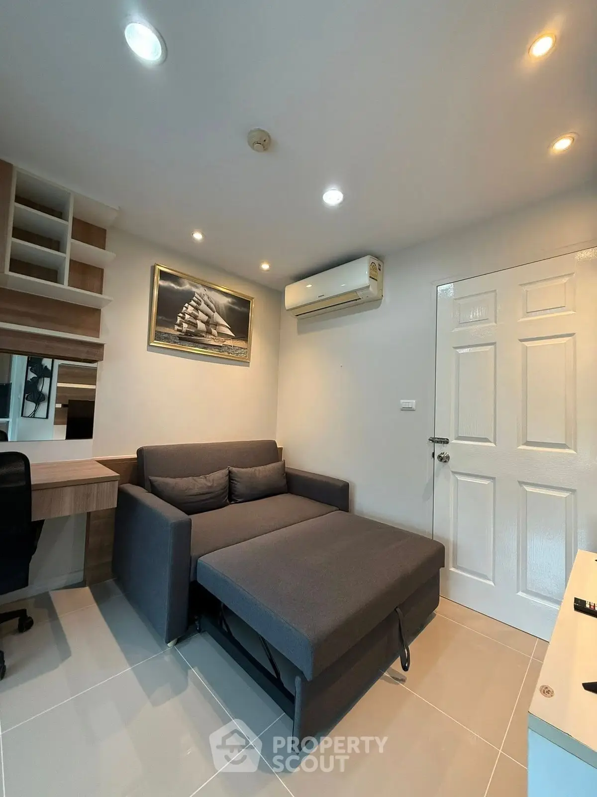 Modern study room with sofa bed and built-in desk