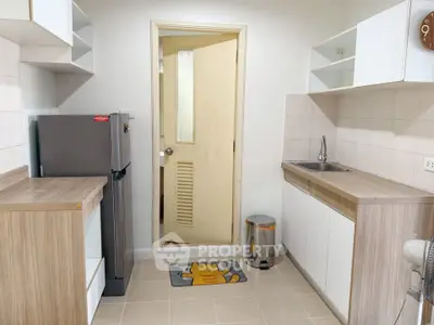 Modern kitchen with sleek cabinets and stainless steel appliances