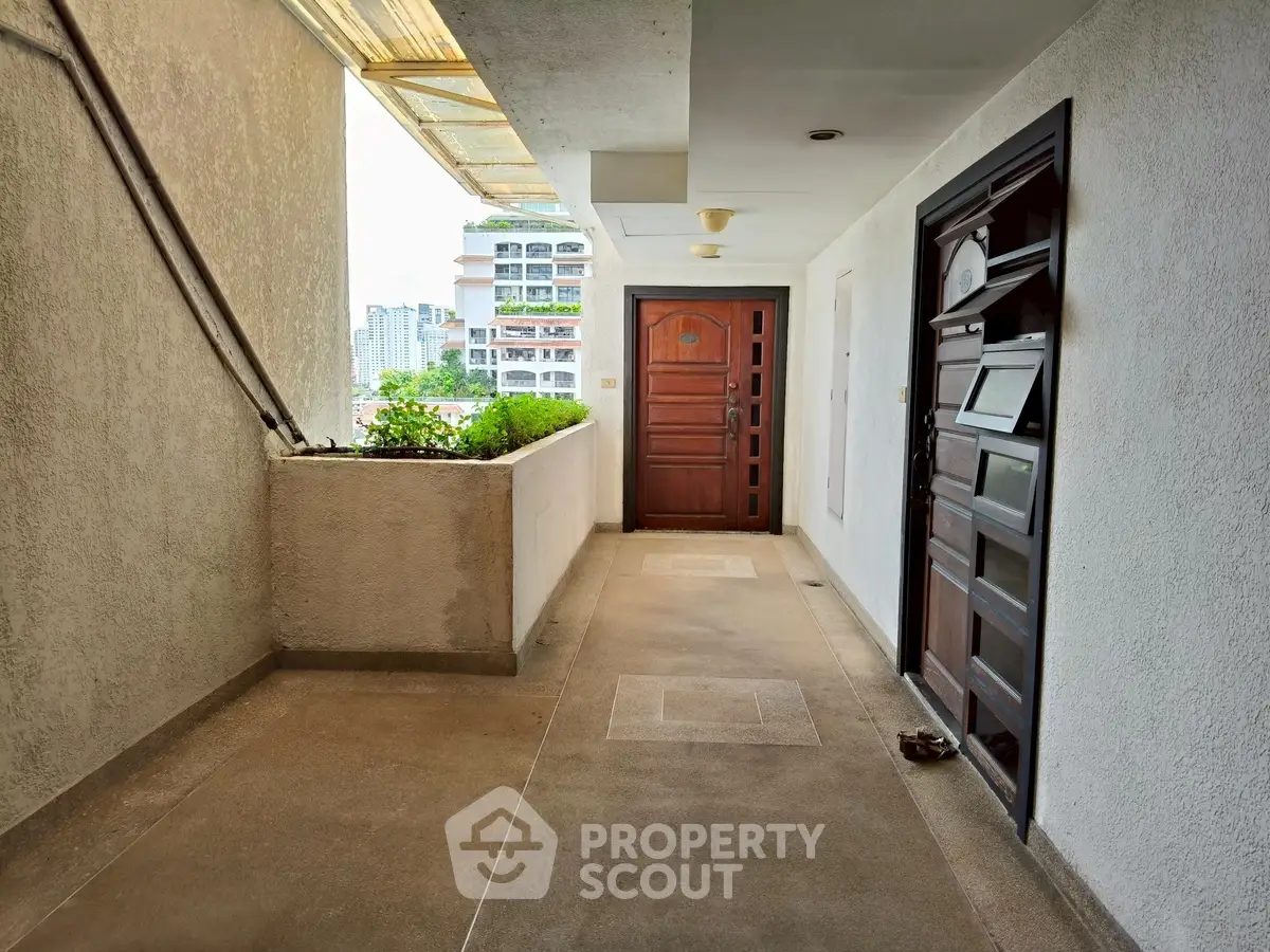 Modern apartment entrance with city view and sleek design