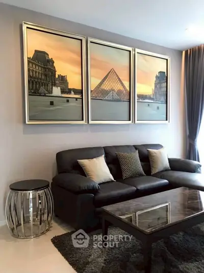 Stylish living room with elegant decor and modern furniture, featuring a chic sofa and artistic wall art.