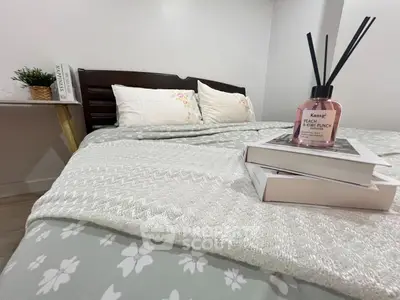 Cozy bedroom with stylish decor and comfortable bedding, perfect for relaxation.