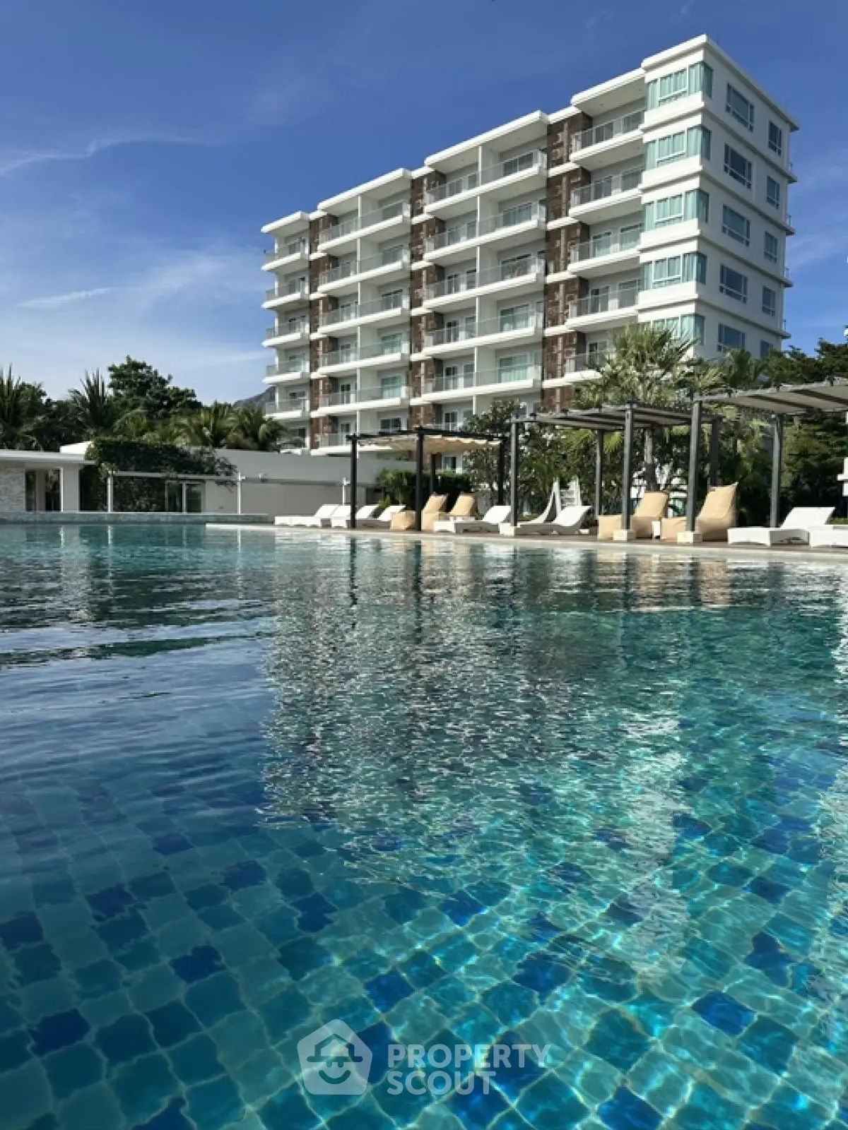Luxurious condominium with stunning pool and modern architecture