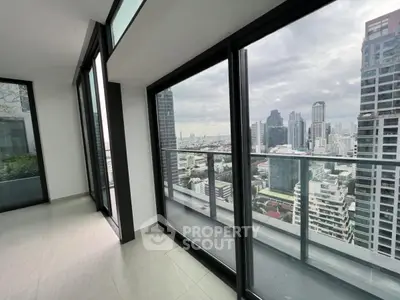 Stunning cityscape view from modern high-rise apartment balcony