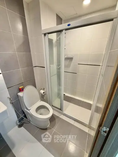 Modern bathroom with sleek shower enclosure and contemporary fixtures