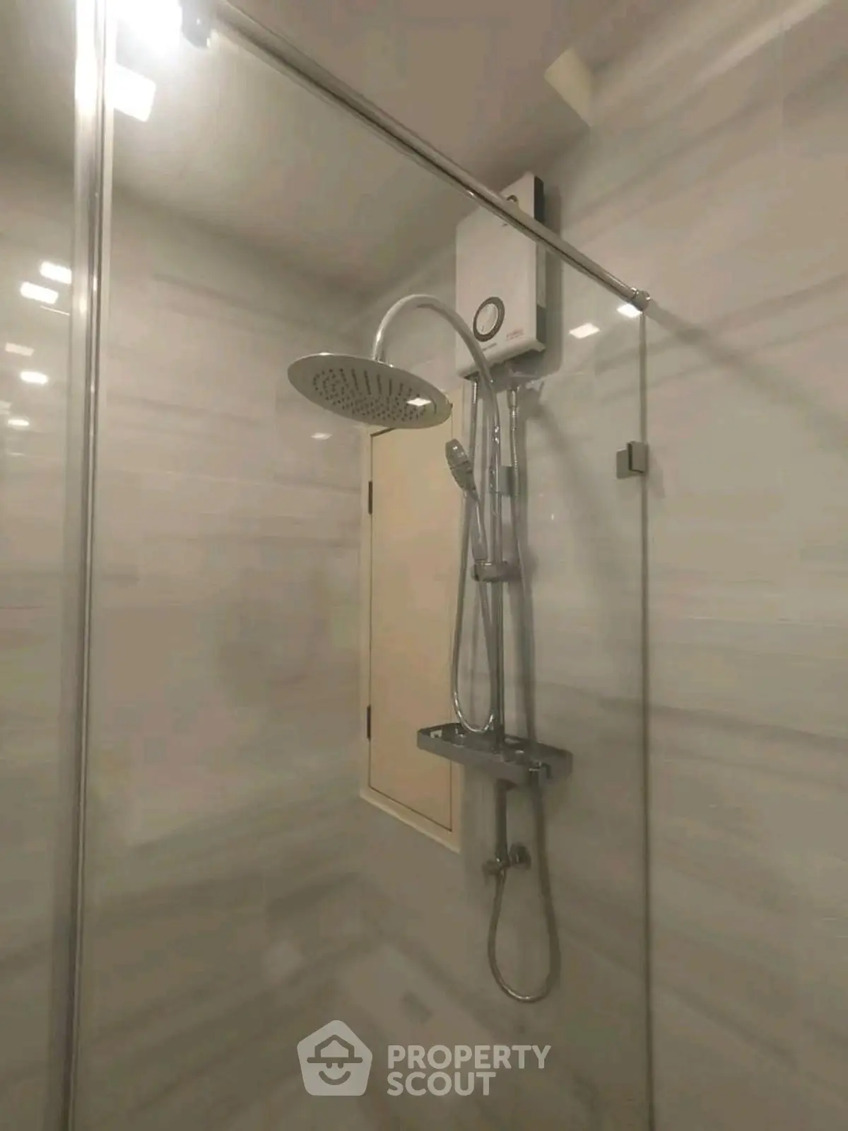 Modern bathroom with sleek shower fixtures and water heater