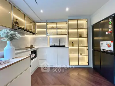 Modern kitchen with sleek cabinetry and elegant lighting