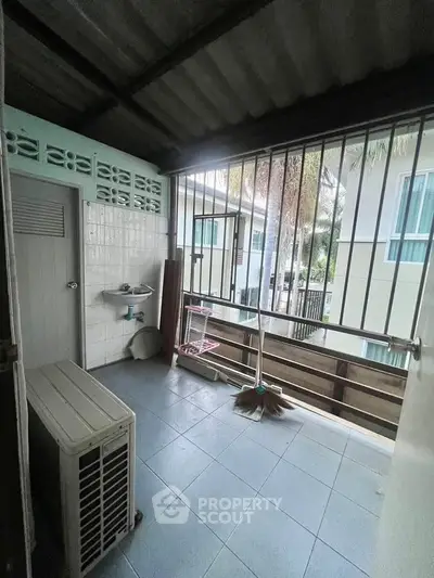 Charming balcony with tiled floor and open view, perfect for relaxation and enjoying fresh air.