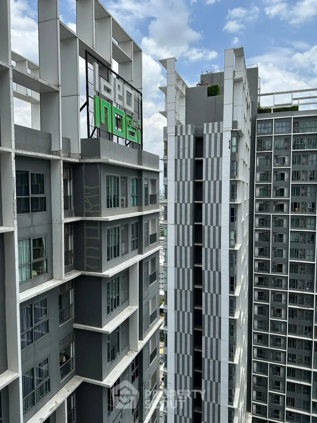 Modern high-rise buildings with sleek architectural design and expansive city views.