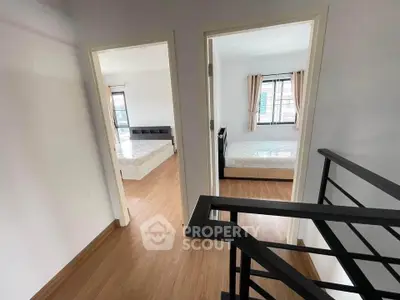 Spacious two-bedroom apartment with modern wooden flooring and ample natural light.