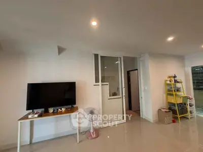 Modern living room with sleek TV setup and minimalist decor