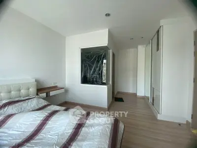 Modern bedroom with sleek design and ample natural light