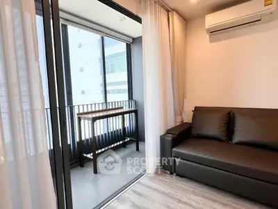 Modern living room with balcony access and sleek furniture