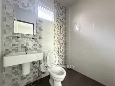 Modern bathroom with stylish tile design and sleek fixtures