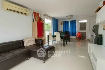 Spacious living room with modern furniture and large windows