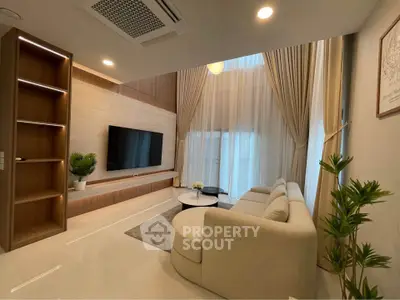 Luxurious modern living room with high ceilings and elegant decor