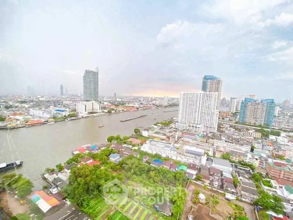 Stunning cityscape view with river and high-rise buildings, perfect for urban living enthusiasts.