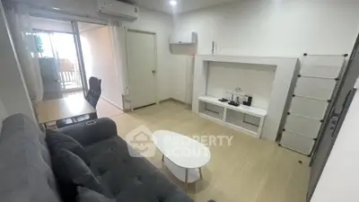 Modern living room with balcony access and stylish furniture