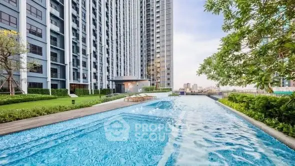 Luxurious high-rise apartment with stunning pool and lush garden view.