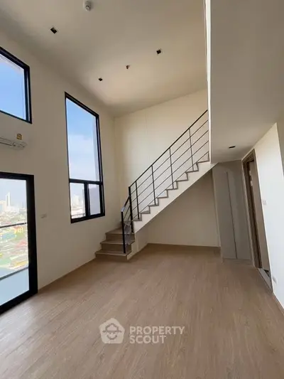 Spacious modern loft with high ceilings and large windows offering city views