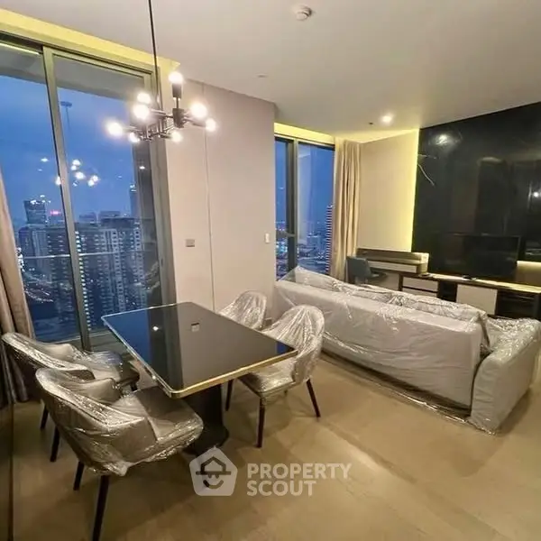 Modern living room with city view, stylish furniture, and elegant lighting.