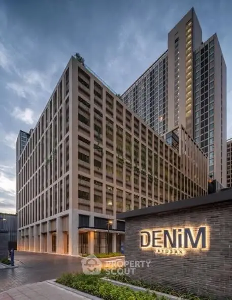 Modern high-rise building with sleek architecture and elegant facade in urban setting.