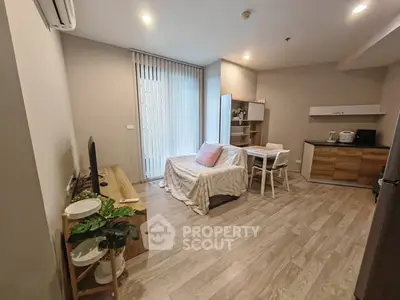 Modern living room with open kitchen and cozy decor