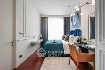 Luxurious bedroom with modern decor and elegant lighting, featuring a plush bed and stylish furnishings.
