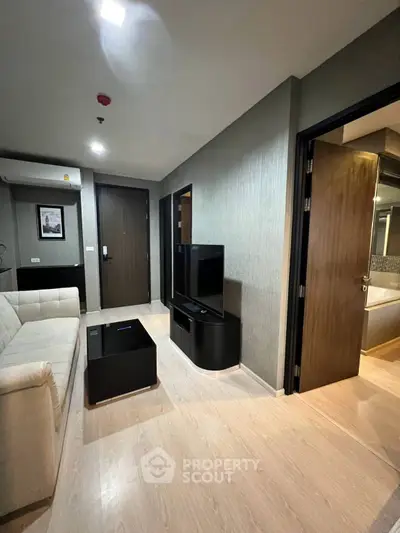 Modern living room with sleek furniture and stylish decor in a contemporary apartment.