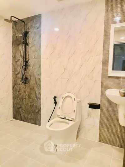Modern bathroom with elegant marble tiles and sleek fixtures