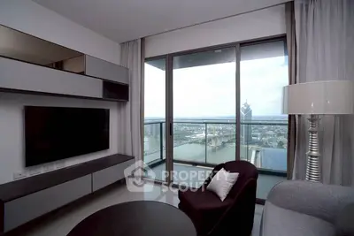 Modern living room with stunning city view from high-rise balcony.