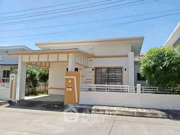Charming single-story house with modern design and carport in a serene neighborhood.