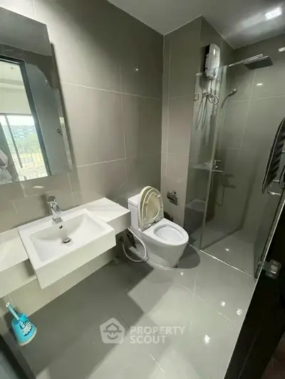 Modern bathroom with sleek design and glass shower enclosure