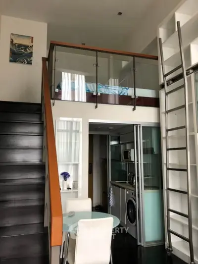 Modern loft apartment with mezzanine bedroom and sleek kitchen design