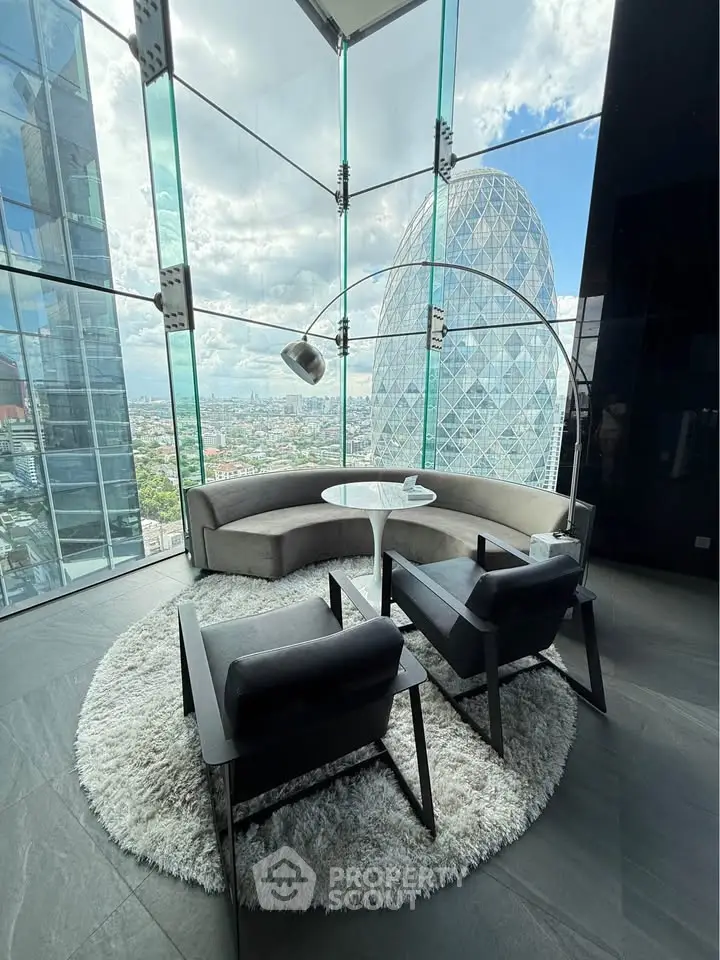 Luxurious modern living room with panoramic city view and stylish furniture.