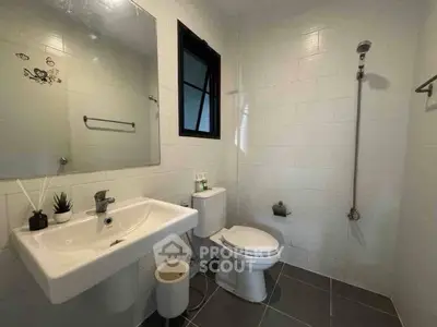 Modern bathroom with sleek fixtures and minimalist design.