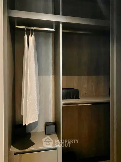 Spacious walk-in closet with modern design and ample storage space.