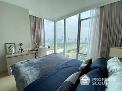 Luxurious bedroom with panoramic city view and elegant decor