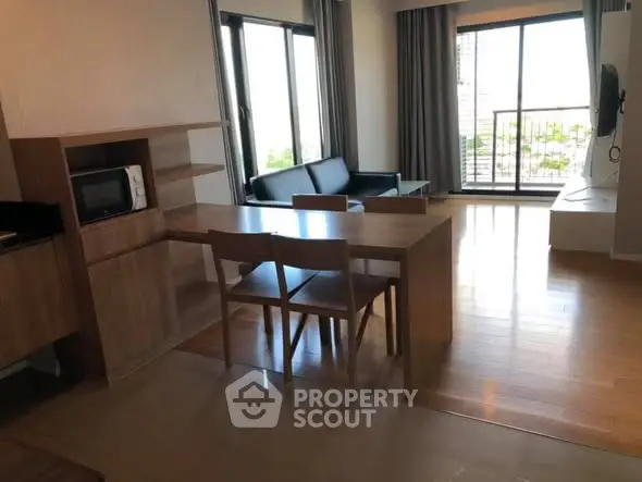 Modern living room with open layout and balcony view