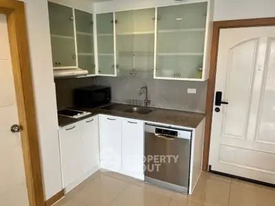 Modern kitchen with sleek cabinetry and stainless steel appliances