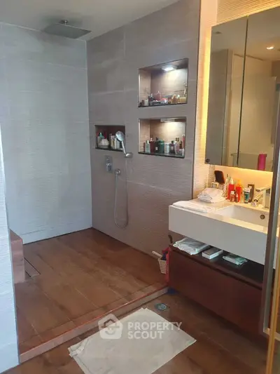 Luxurious modern bathroom with walk-in shower and elegant vanity